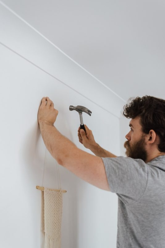 man using a hammer